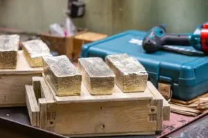 Cast gold bars in a workshop